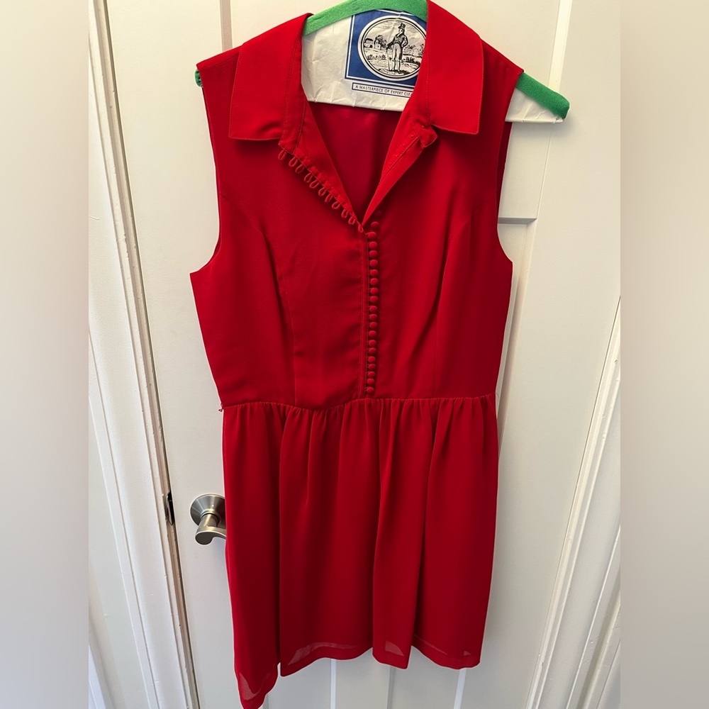 Red dress with sheer cloth belt.